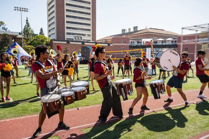 Ian Cervantes performing with the USC marching band drumline on campus